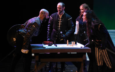 Photo of rebels around table with chess pieces on map